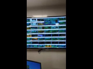 this is what a chinese game bot farm looks like. 6 huge screens, each with 64 running world of warcraft clients - 384 active